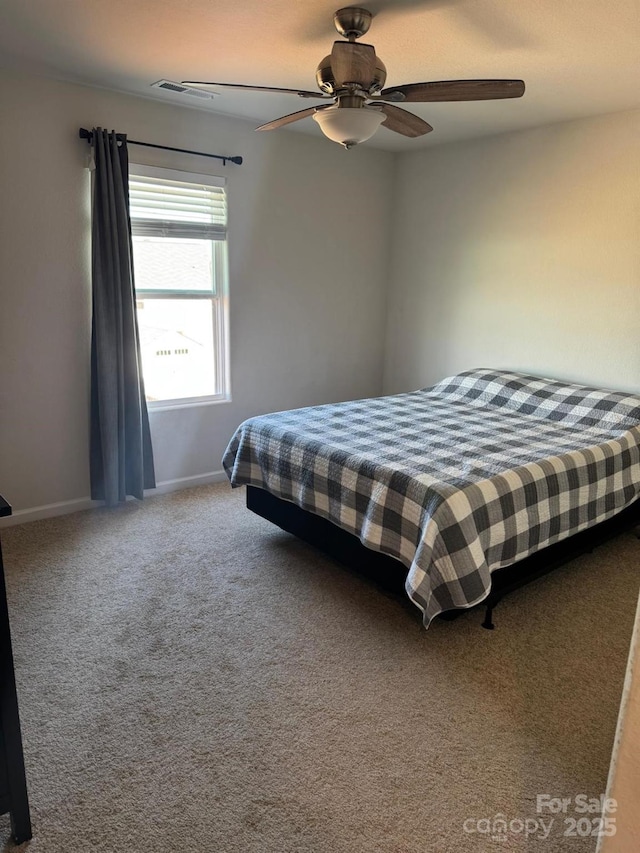 carpeted bedroom featuring ceiling fan