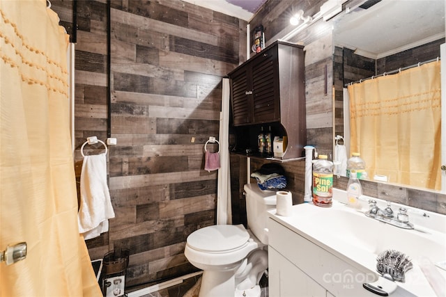 bathroom with toilet, vanity, wooden walls, and curtained shower