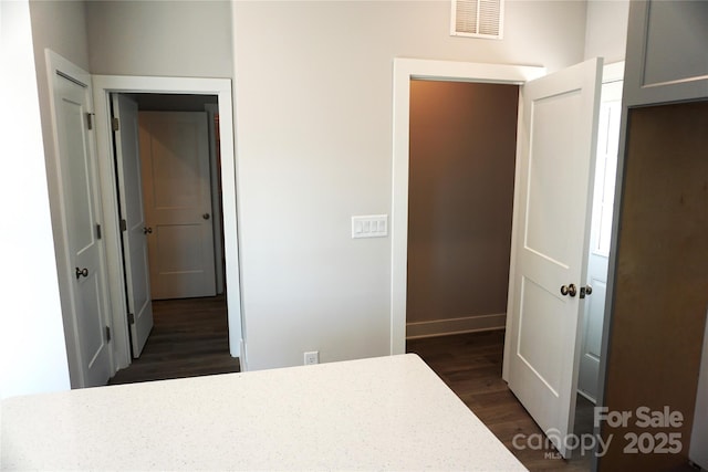 bedroom with dark hardwood / wood-style flooring