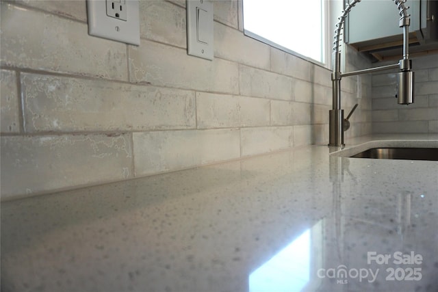 details with sink and light stone countertops