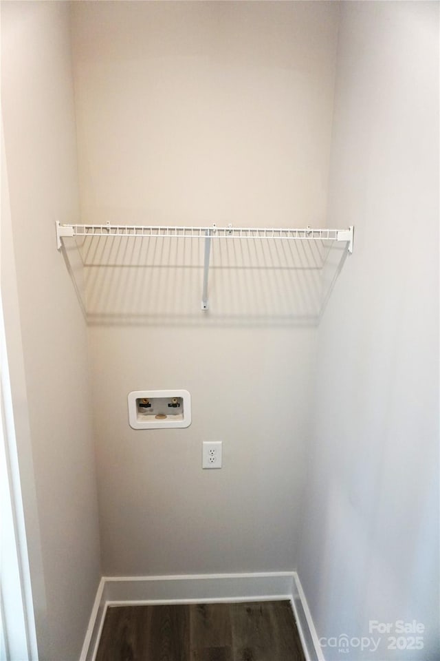 clothes washing area with hookup for a washing machine and dark wood-type flooring