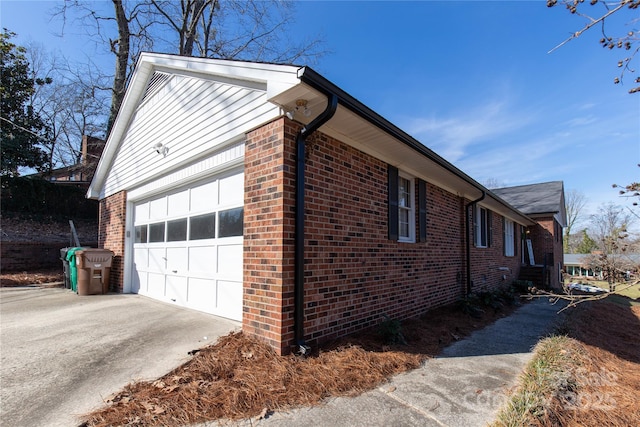 view of side of home with a garage