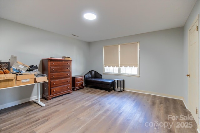 office with light wood-type flooring