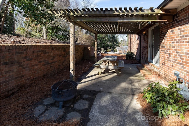 view of patio / terrace featuring a pergola and a fire pit