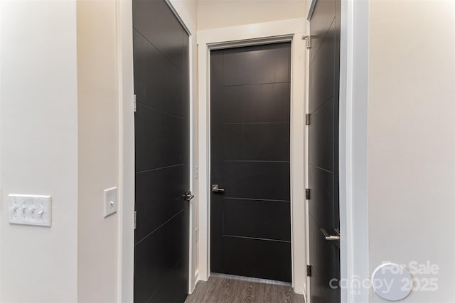 corridor featuring dark hardwood / wood-style floors