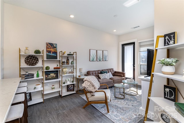 living room with dark hardwood / wood-style floors