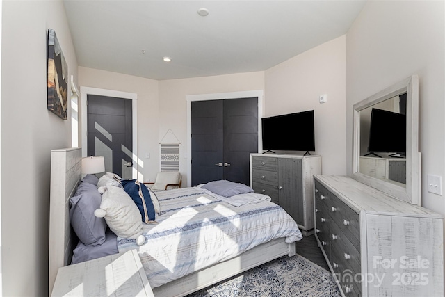 bedroom with wood-type flooring