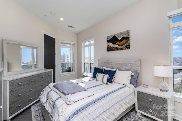 bedroom with dark wood-type flooring