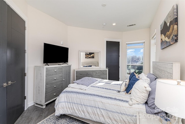 bedroom featuring dark wood-type flooring