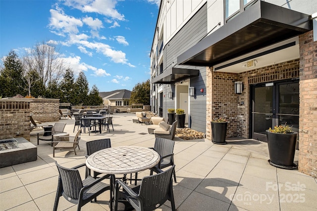 view of patio with an outdoor fire pit