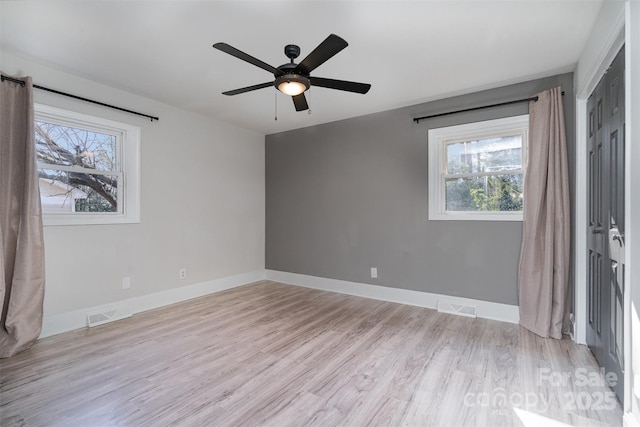 unfurnished bedroom with light hardwood / wood-style floors and ceiling fan