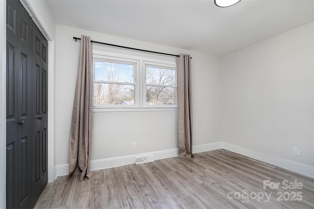 unfurnished bedroom featuring light hardwood / wood-style flooring