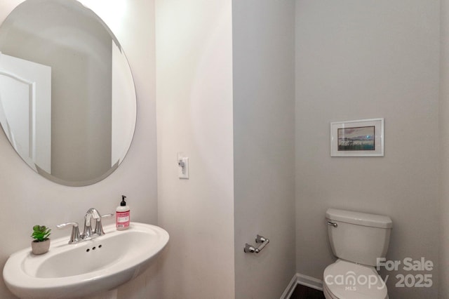 bathroom with sink and toilet