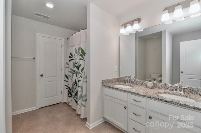 bathroom with vanity, tile patterned floors, toilet, and a shower with shower curtain