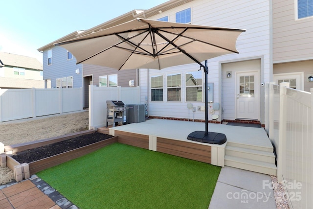 view of patio featuring a deck, grilling area, and central air condition unit