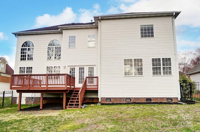 rear view of property featuring a yard, crawl space, fence, and a wooden deck