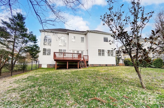 back of property featuring crawl space, a fenced backyard, a lawn, and a wooden deck