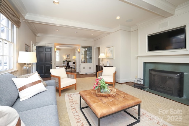 living room featuring beamed ceiling, ornamental molding, and light wood-type flooring