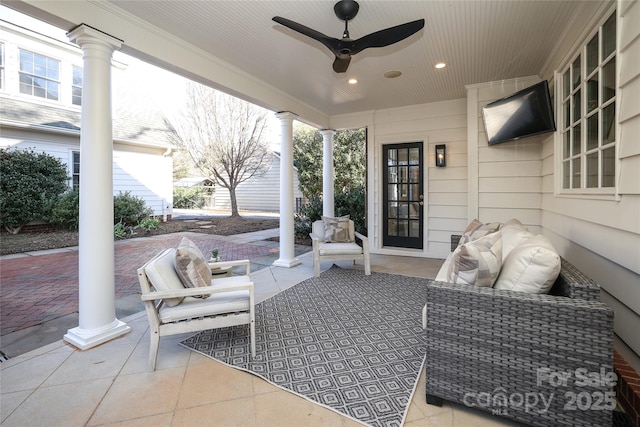 view of patio featuring an outdoor living space and ceiling fan