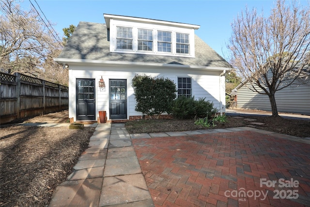 back of property featuring a patio