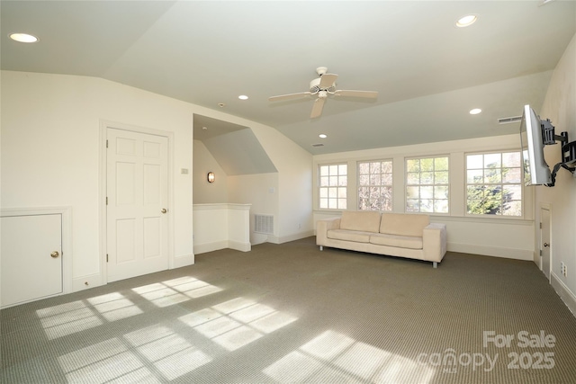 additional living space featuring a wealth of natural light, vaulted ceiling, ceiling fan, and carpet