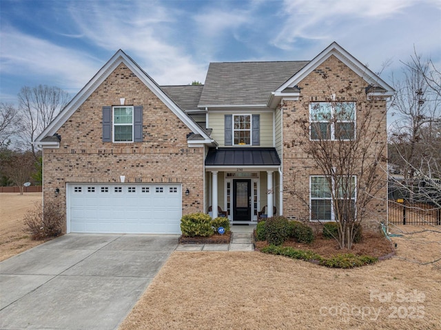 view of front of property with a garage