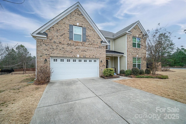 view of front of property with a garage and a front yard