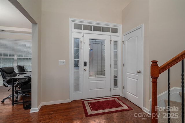 foyer with dark wood-type flooring