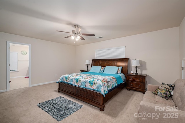 carpeted bedroom with connected bathroom and ceiling fan