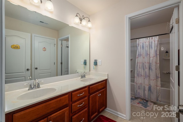 bathroom featuring vanity, shower / tub combo, and tile patterned floors