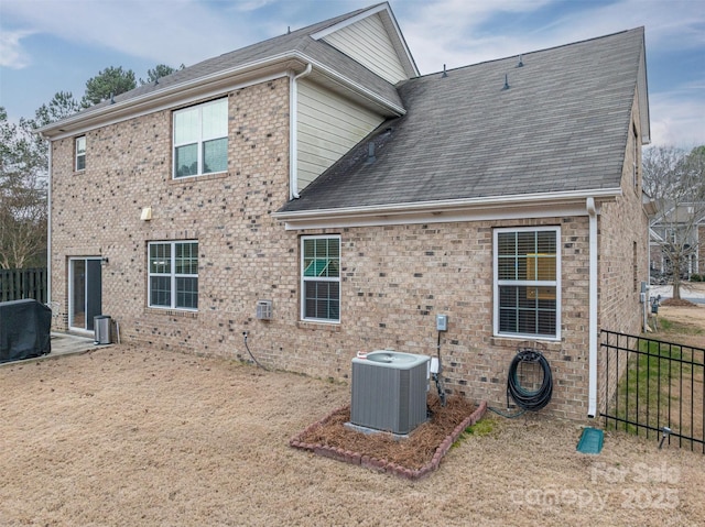 rear view of house with cooling unit