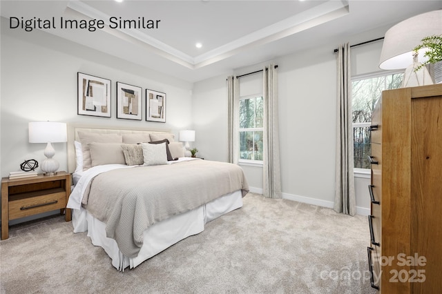 bedroom featuring ornamental molding, a tray ceiling, and light carpet