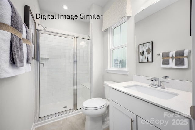 bathroom featuring vanity, a shower with door, and toilet