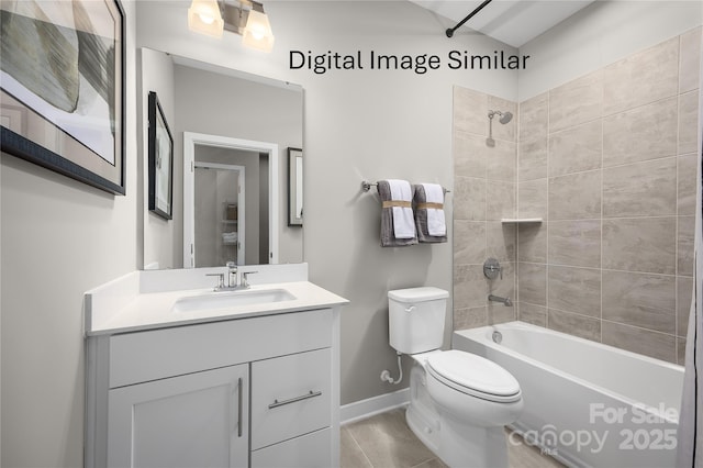 full bathroom featuring tiled shower / bath, vanity, and toilet