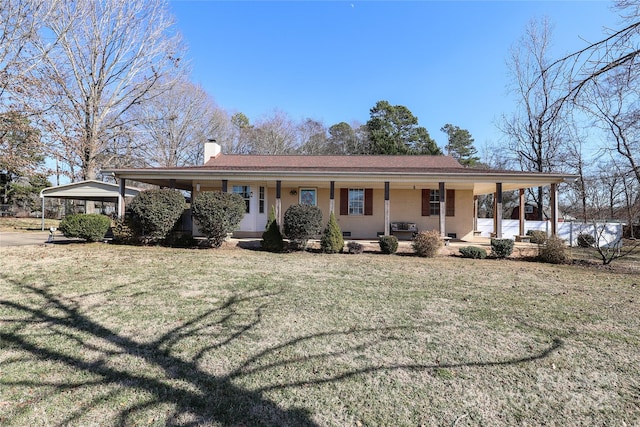 single story home featuring a front lawn, a carport, and a porch