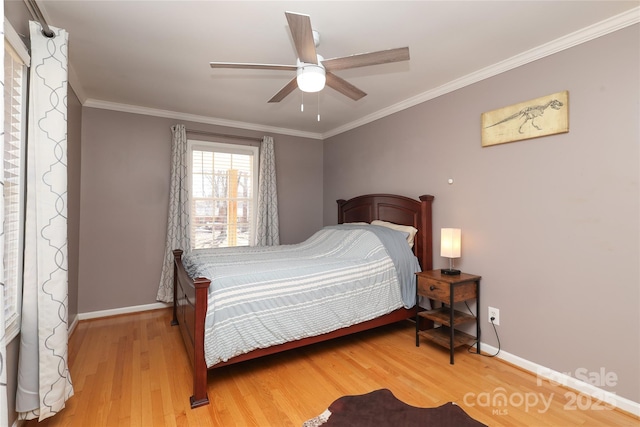 bedroom with crown molding, wood-type flooring, and ceiling fan