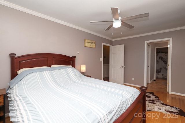 bedroom featuring ornamental molding, ceiling fan, and light wood-type flooring