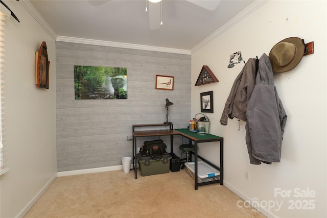 interior space with crown molding, light colored carpet, and ceiling fan