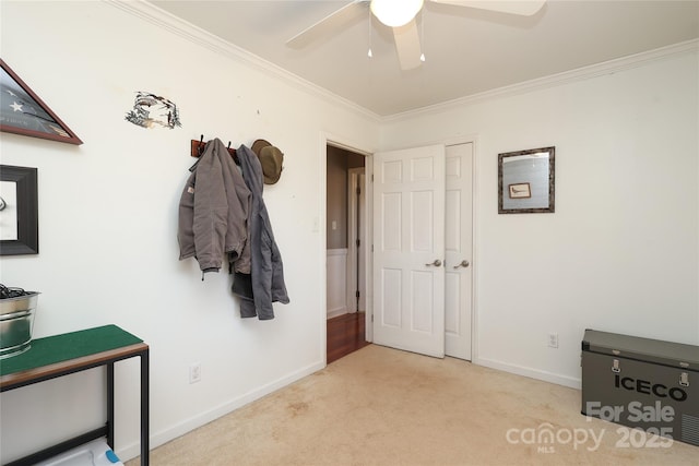 interior space featuring ornamental molding and ceiling fan