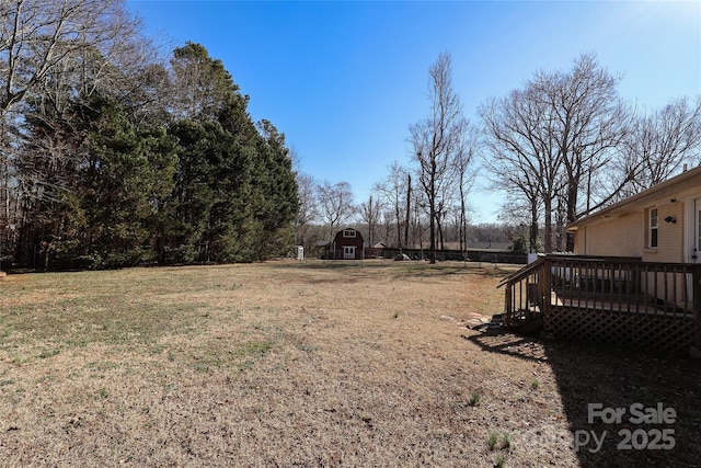 view of yard featuring a wooden deck