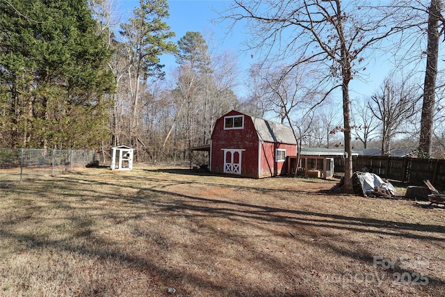 view of outbuilding with a yard