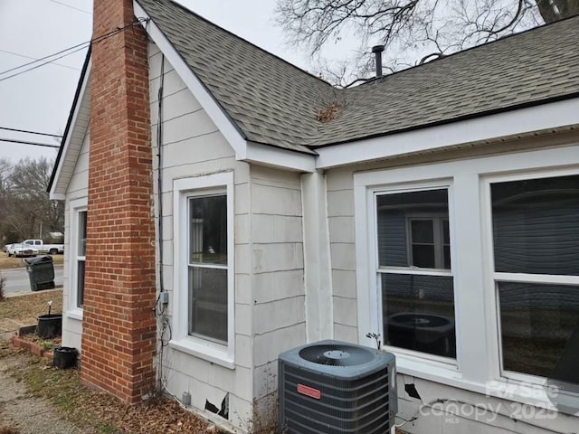 view of side of property with cooling unit