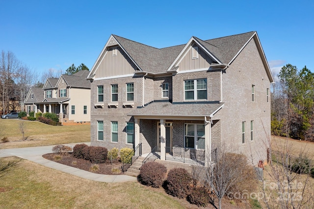 view of front of house featuring a front yard and a porch