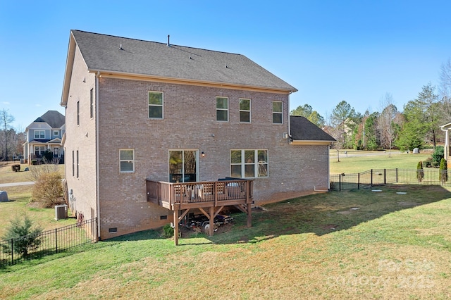 rear view of property with central AC, a deck, and a lawn