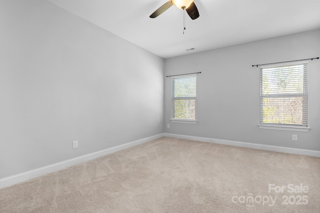 unfurnished room featuring ceiling fan and light colored carpet