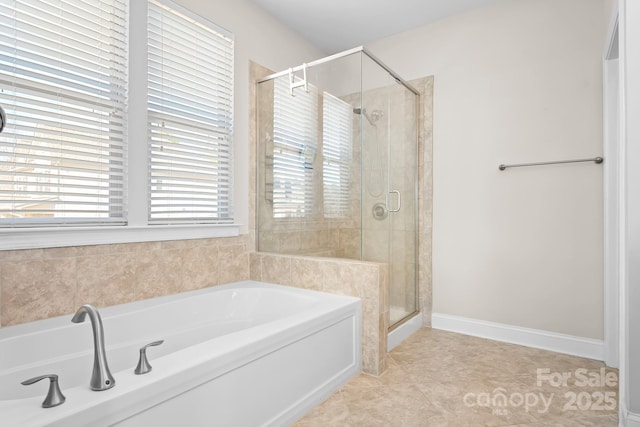 bathroom with separate shower and tub and tile patterned flooring