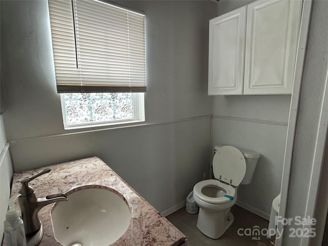 bathroom with vanity and toilet