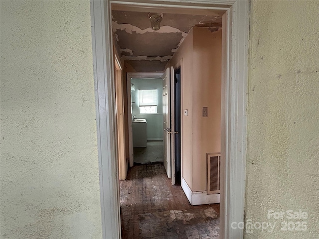 hallway with dark wood-type flooring