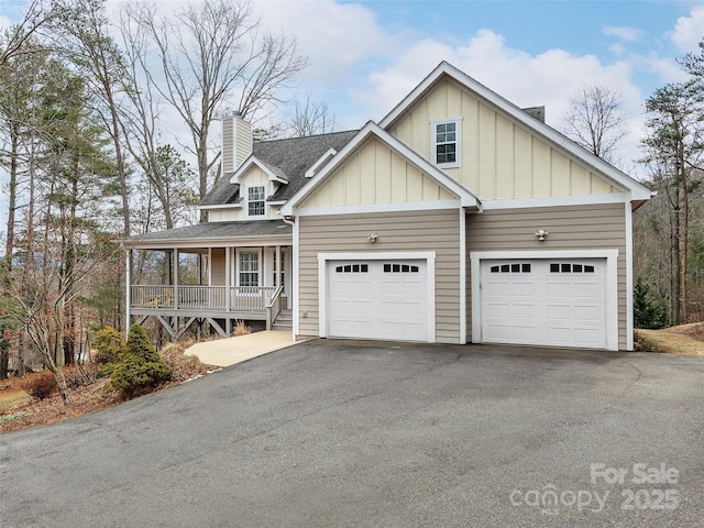 view of front of home featuring a garage and covered porch