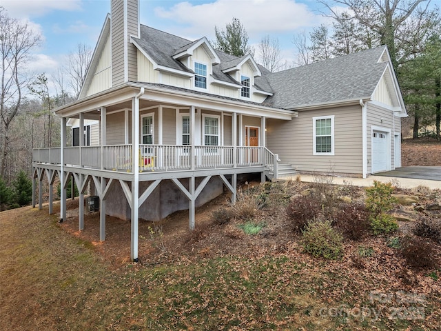 view of front of house with a garage and covered porch